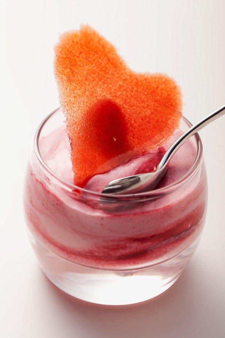 Raspberry dessert decorated with a sugar heart