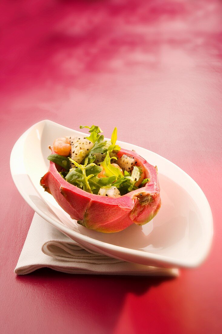 A prawn salad with dragonfruit in a hollowed out dragonfruit