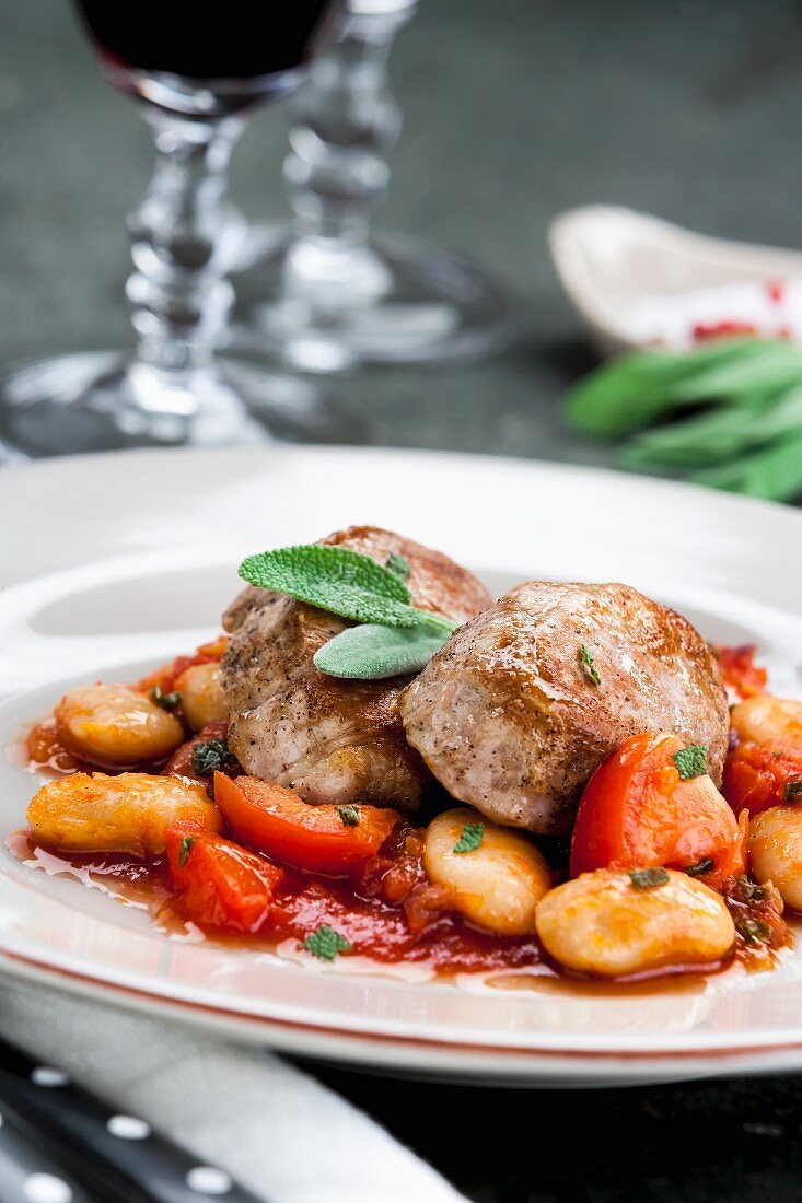 Pork fillet on a bean and tomato medley