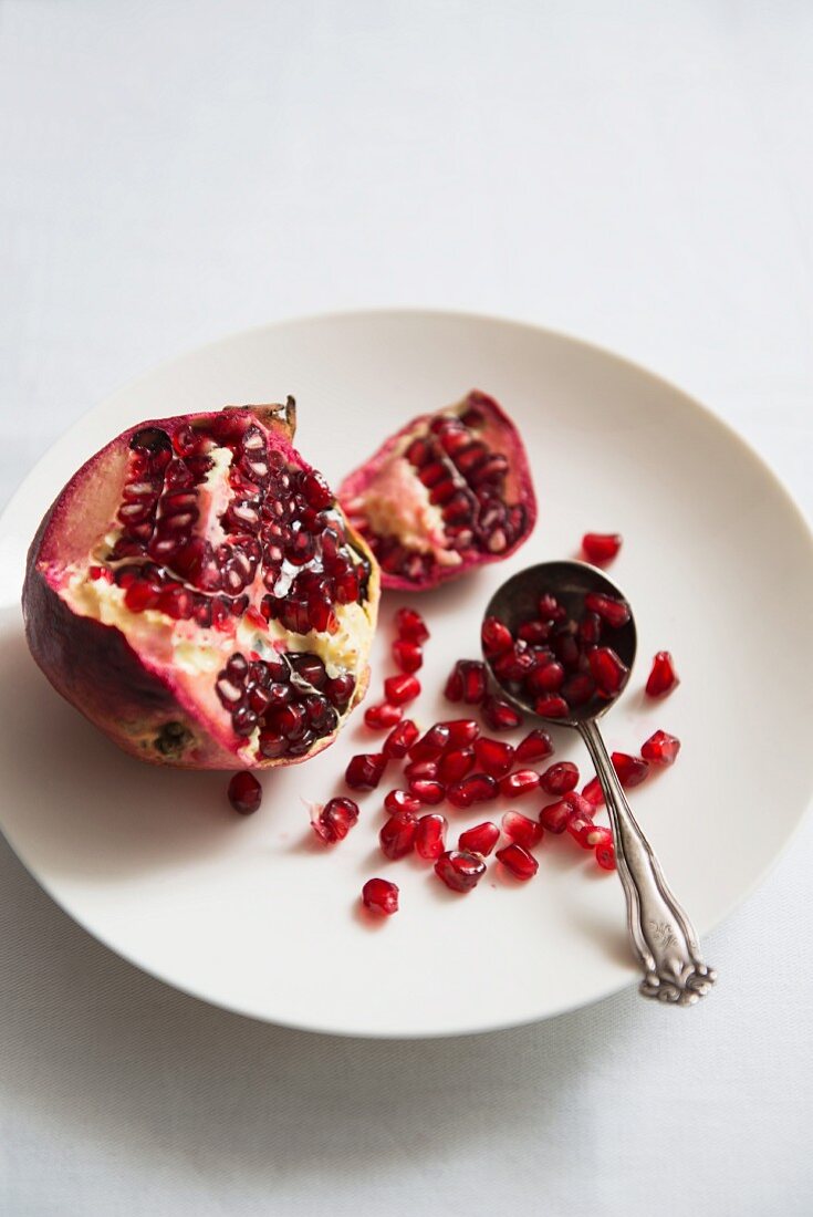A sliced pomegranate on a plate