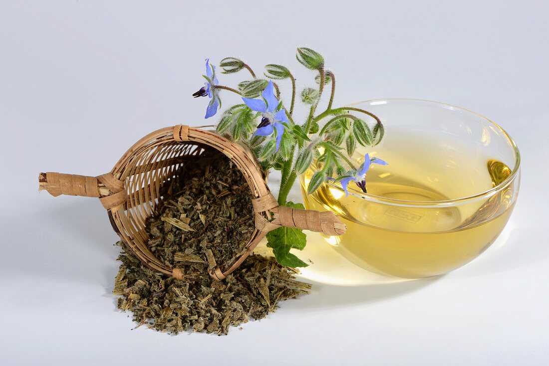 Borage tea, tea leaves and borage flowers