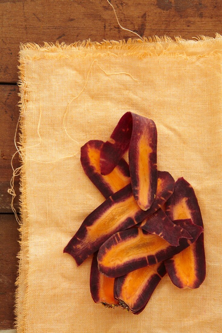 Carrot strips on a yellow cloth