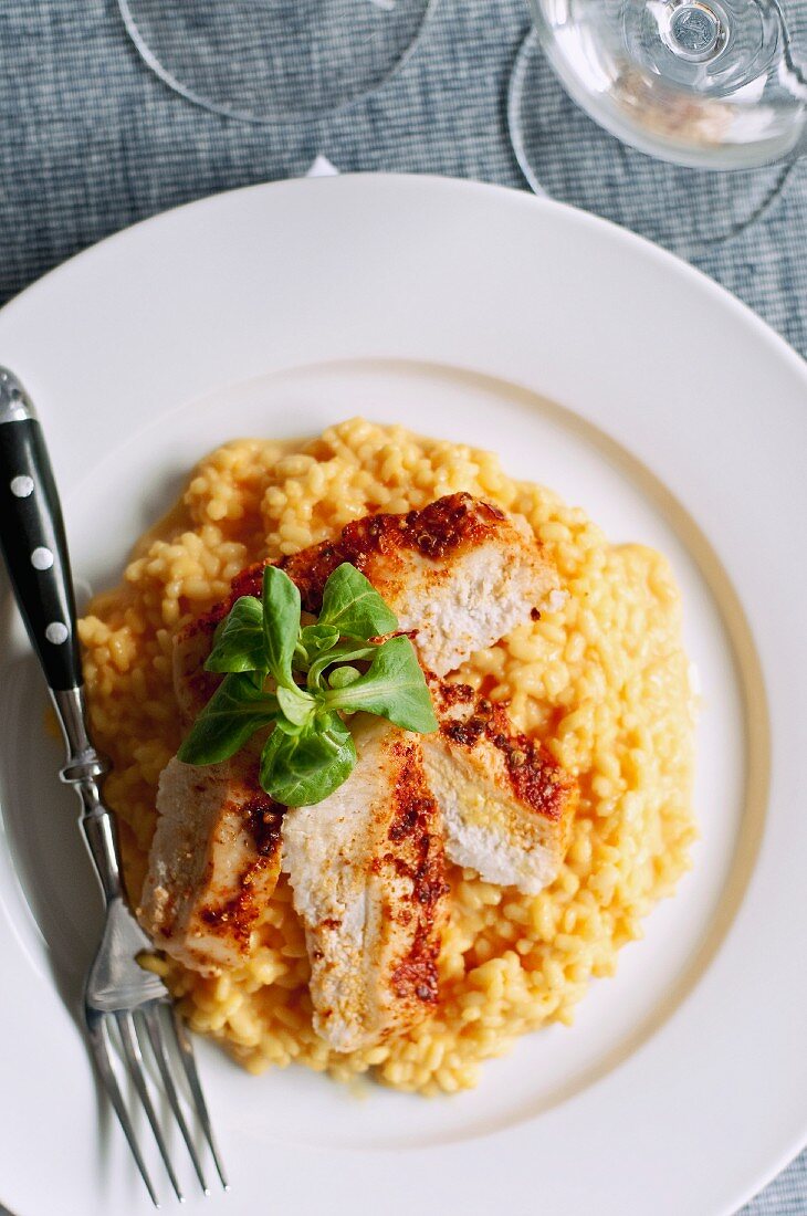 Saffron risotto with chicken and lamb's lettuce