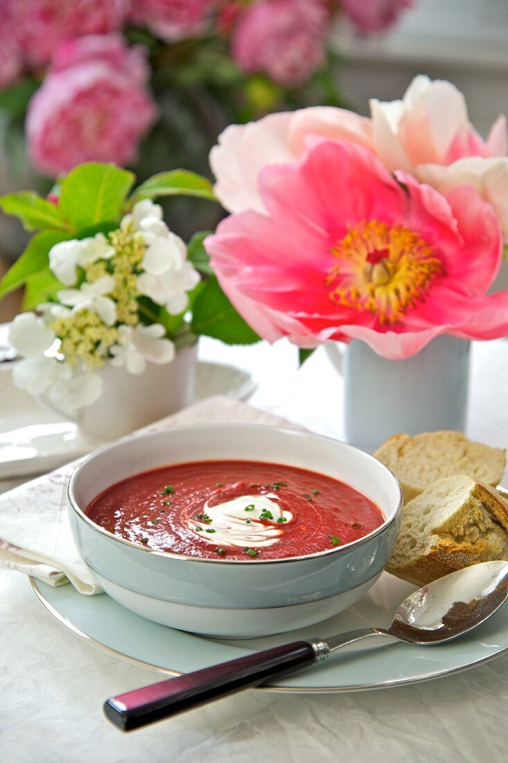 Beetroot soup with sour cream and bread