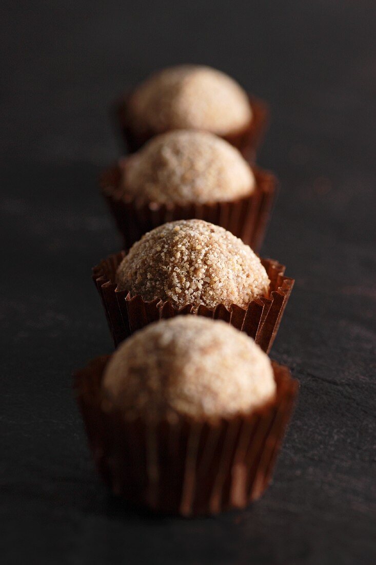 A row of cappuccino truffle pralines