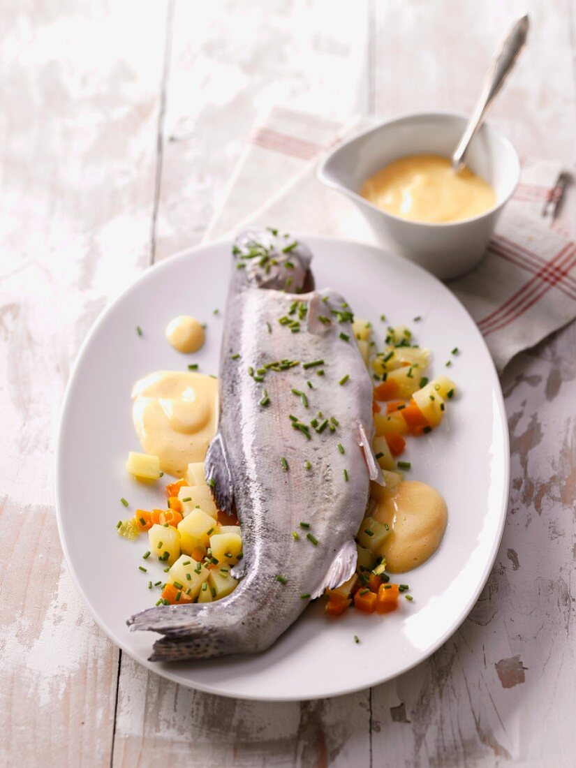Poached trout with mayonnaise and vegetables