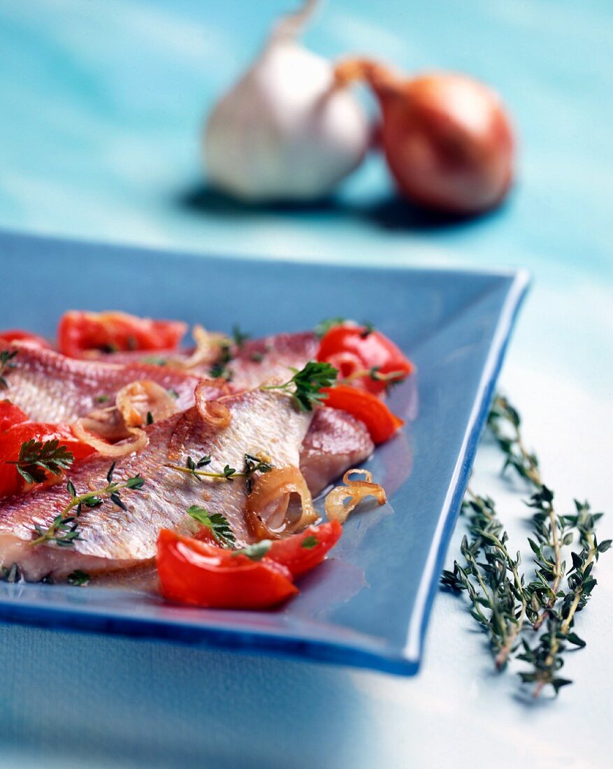 Triglie alla livornese (red mullet with tomatoes, onions and thyme)