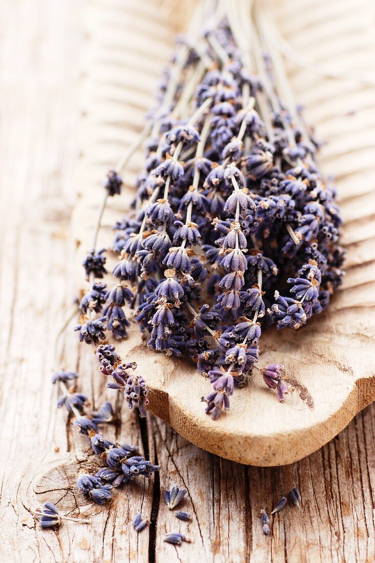 Lavender flowers in a wooden dish