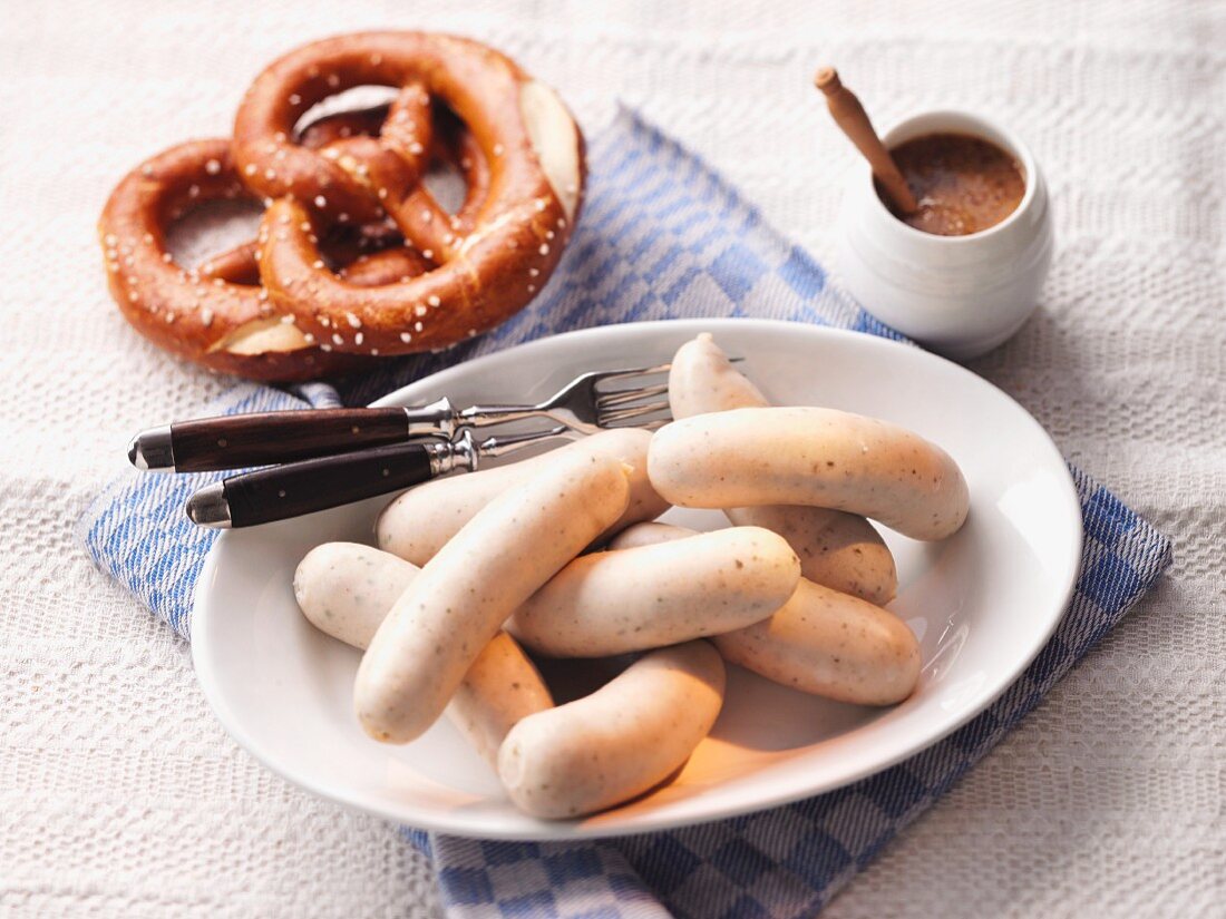 White sausage, mustard and pretzels