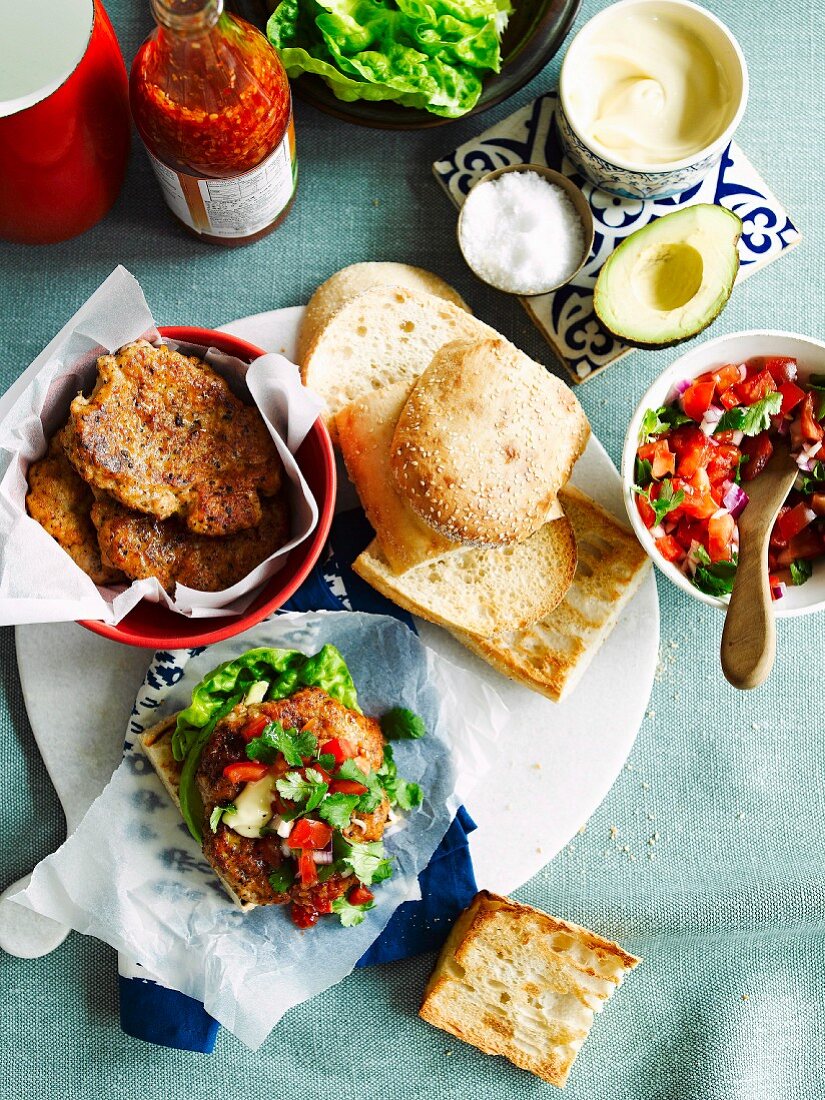 Cajun-spiced chicken burgers with salsa and avocado