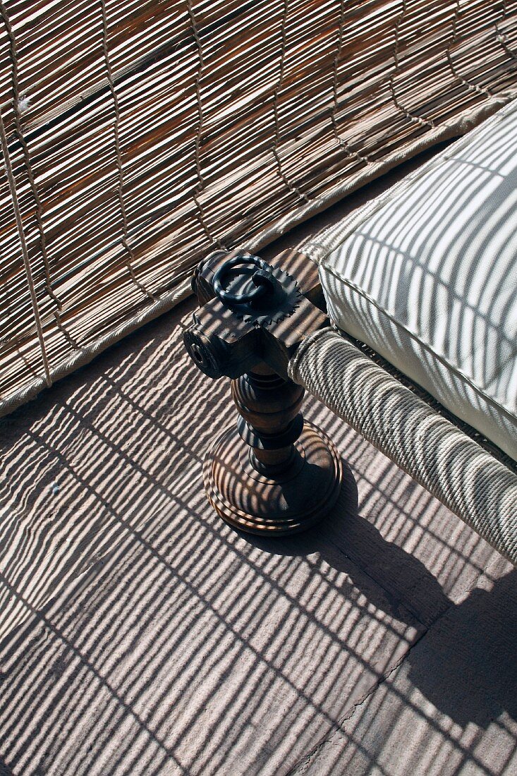 Detail of chair next to bamboo blind in Raas Haveli Hotel, Jodhpur, India
