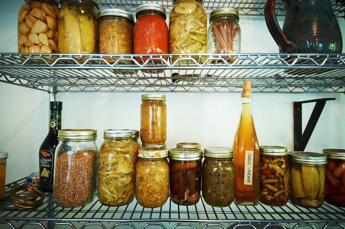 Various Pickles, Jams, and Preserved Food on Wire Shelves