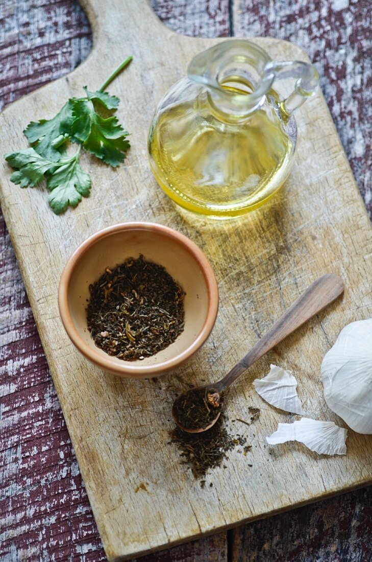 A spice mixture, garlic, coriander and olive oil