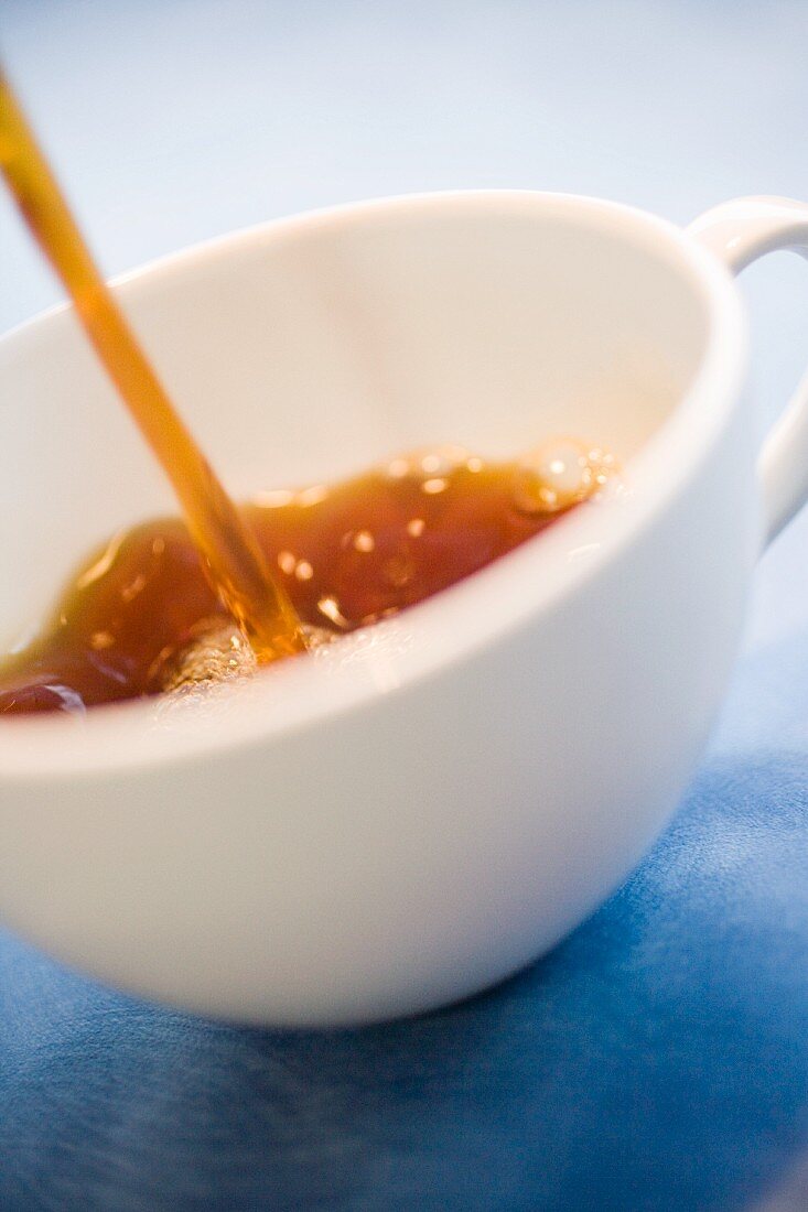 Pouring coffee into a cup