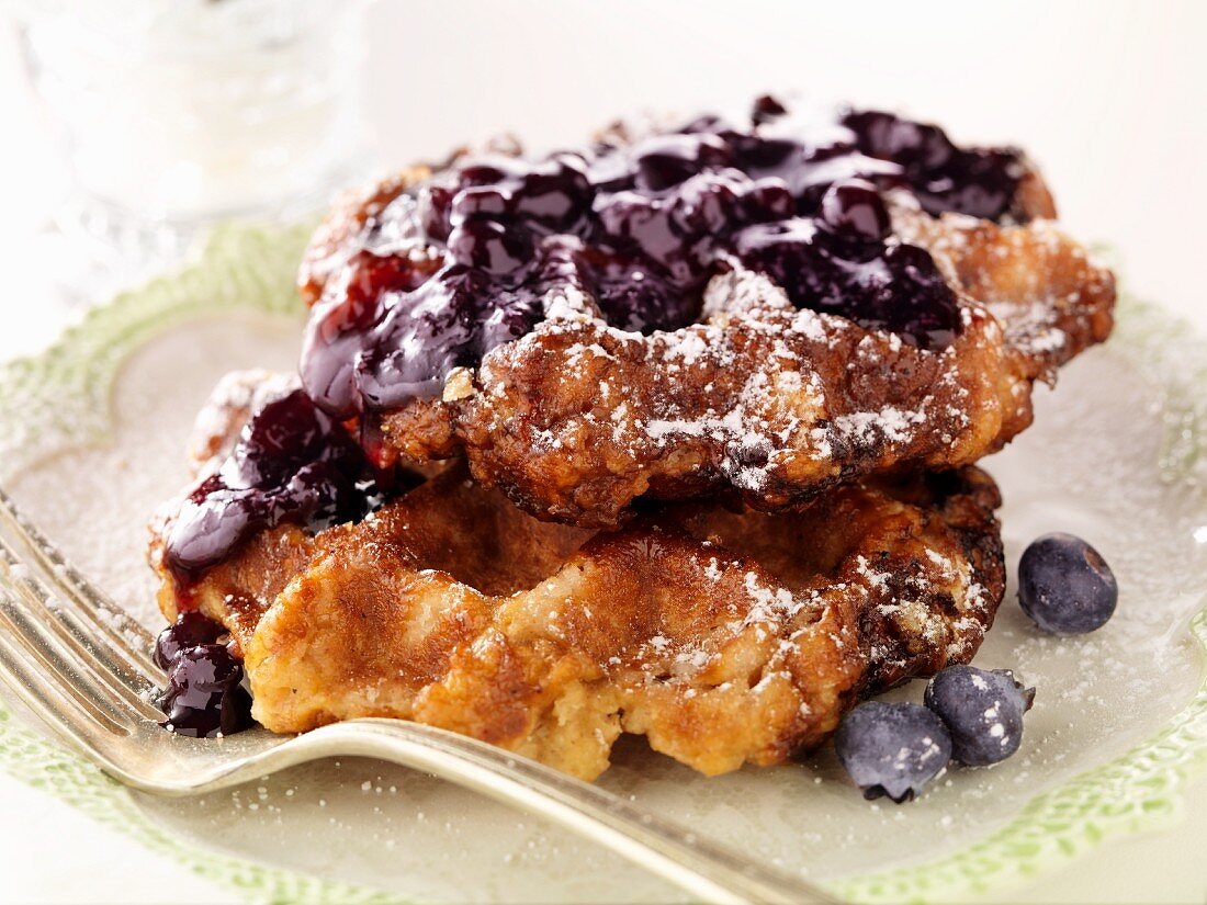 Liege Waffles with Blueberry Sauce on a Plate with a Fork