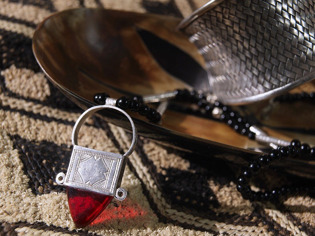 African jewellery in wooden dish