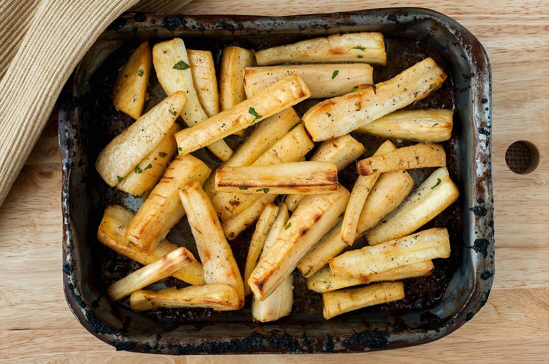 Roast parsnips in an old roasting tin