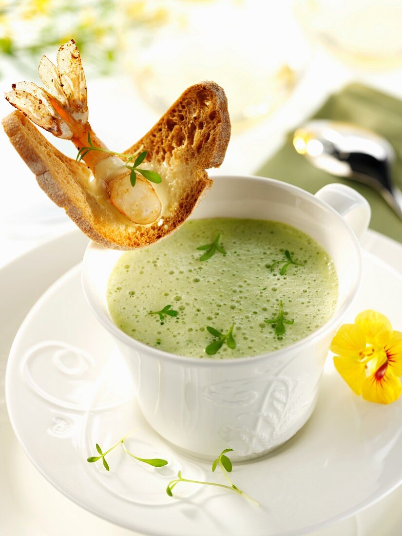 Foamed cress soup with a prawn crostini