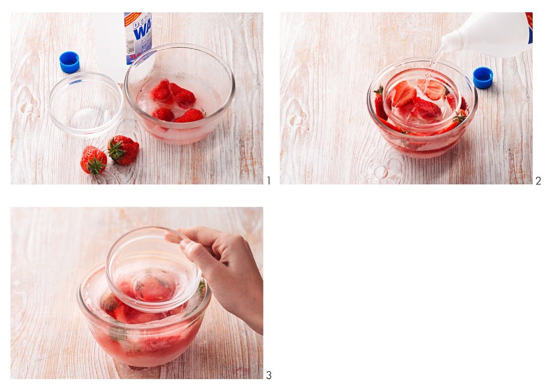 A bowl of iced strawberries being made