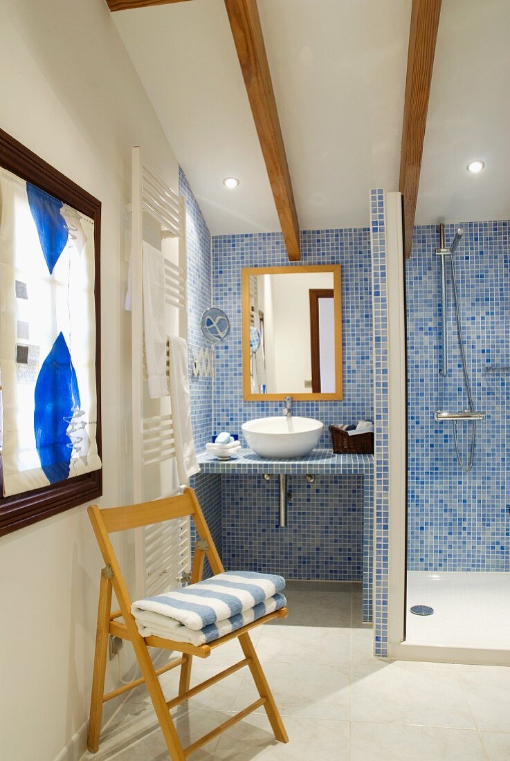 Attic bathroom with tiled shower area
