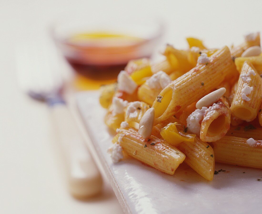 Penne with tomato sauce, ricotta and pine nuts
