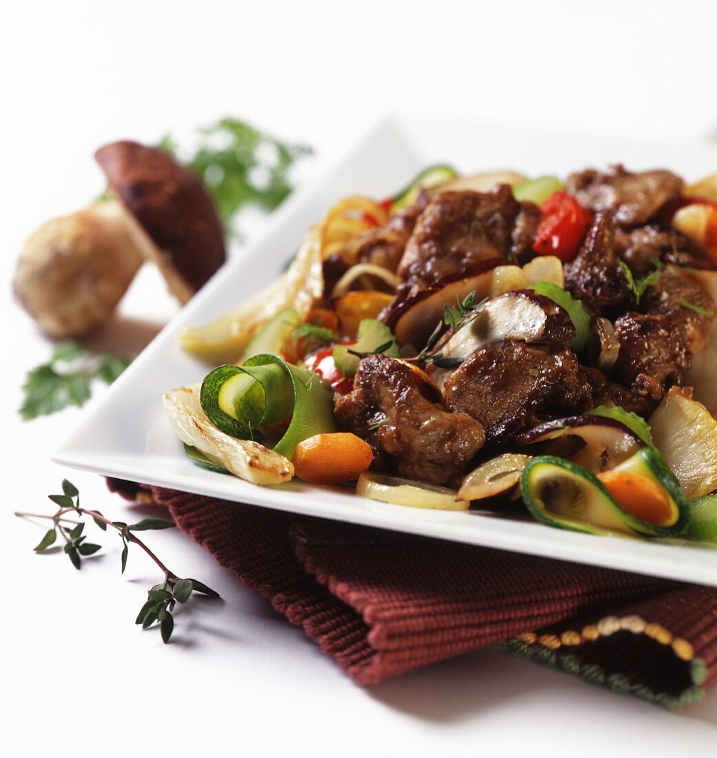 Beef steak with porcini mushrooms and grilled vegetables