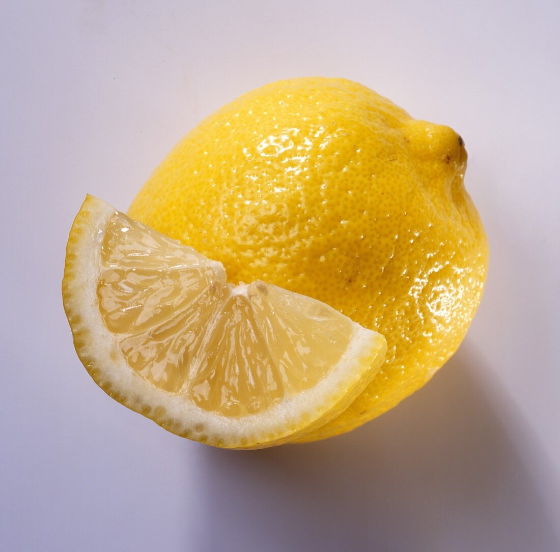 A lemon and a half-slice of lemon