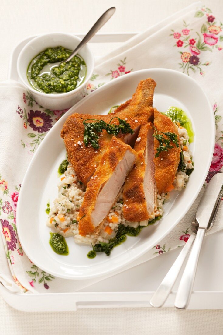 Breaded pork schnitzel with pesto