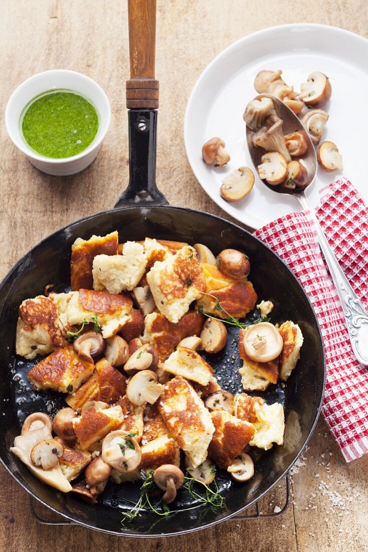 Chopped-up potato pancakes with mushrooms