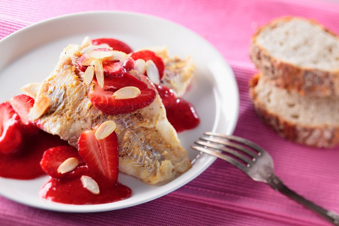Fried fillet of fish with strawberry sauce