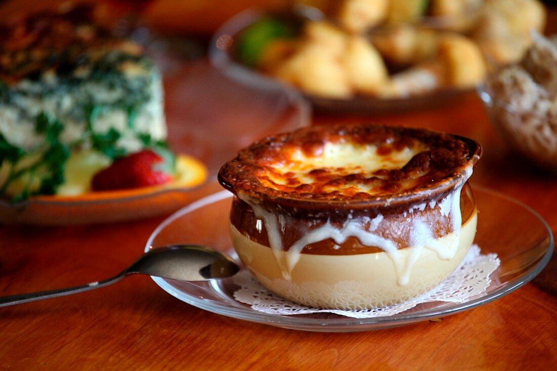 Bowl of French Onion Soup on a Glass Plate