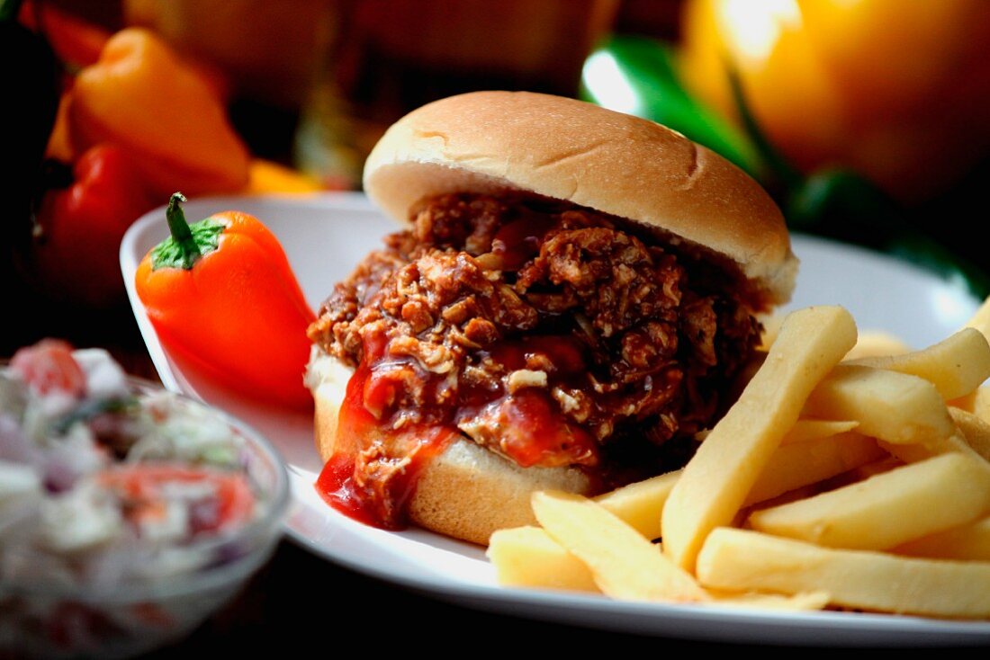 Chopped Barbecue Beef Sandwich on a Bun with French Fries