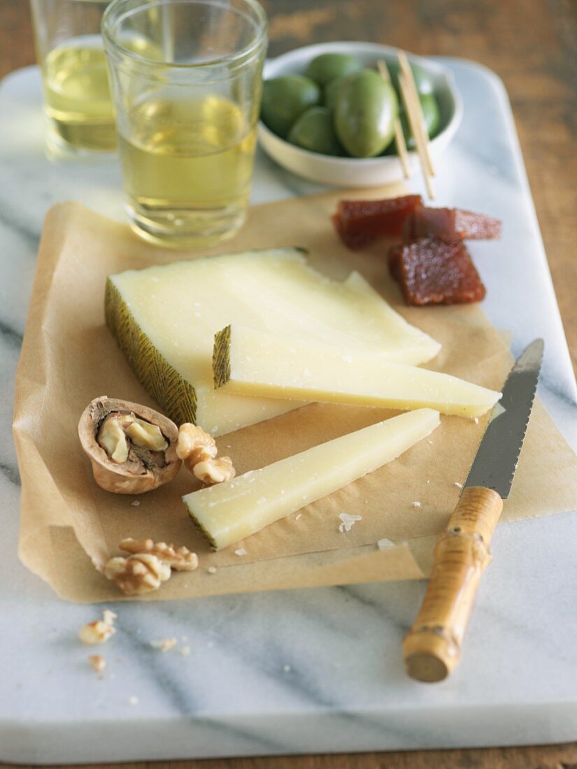 Manchego Cheese with Walnuts, Olives and Fruit Paste
