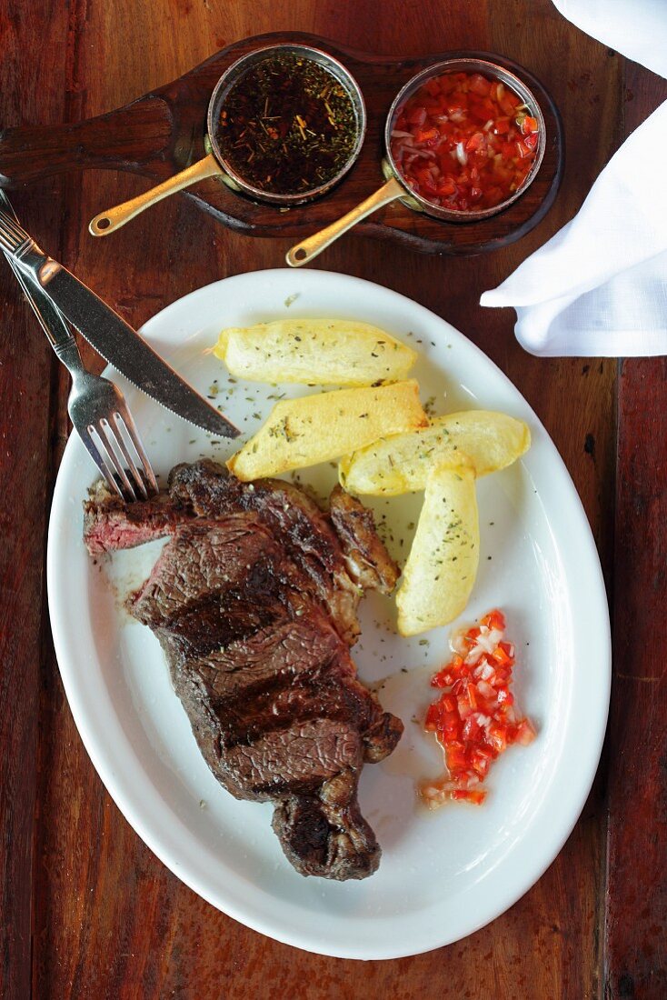 Beef steak with chips and salsa (Argentina)
