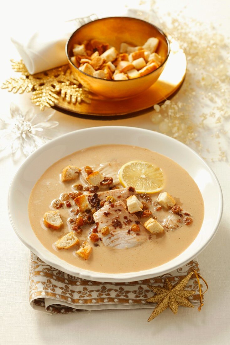 Carp soup with raisins, plum jam and croutons (Christmassy)