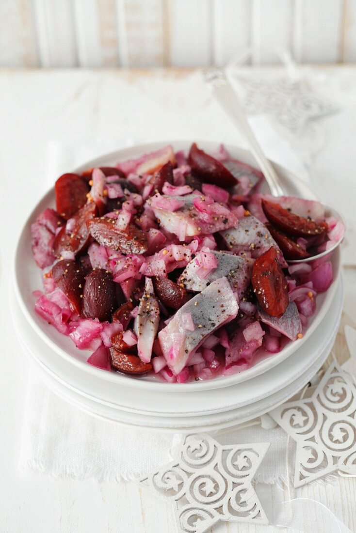 A salad of herring with preserved plums and red onions (Christmassy)