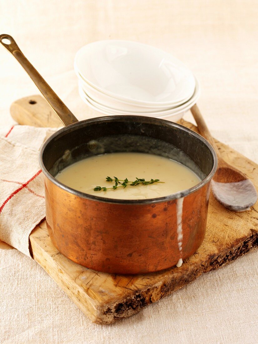 Parsnip soup in a copper pan