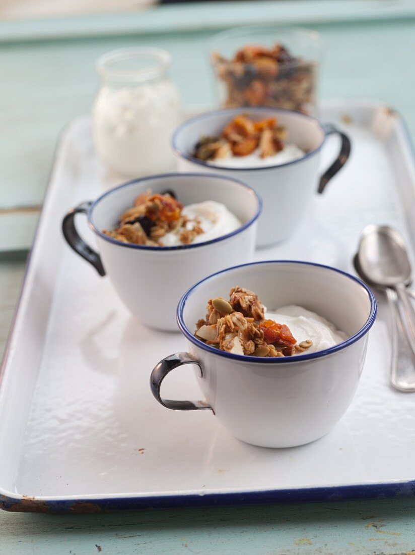 Cups of Greek Yogurt with Granola on a Tray