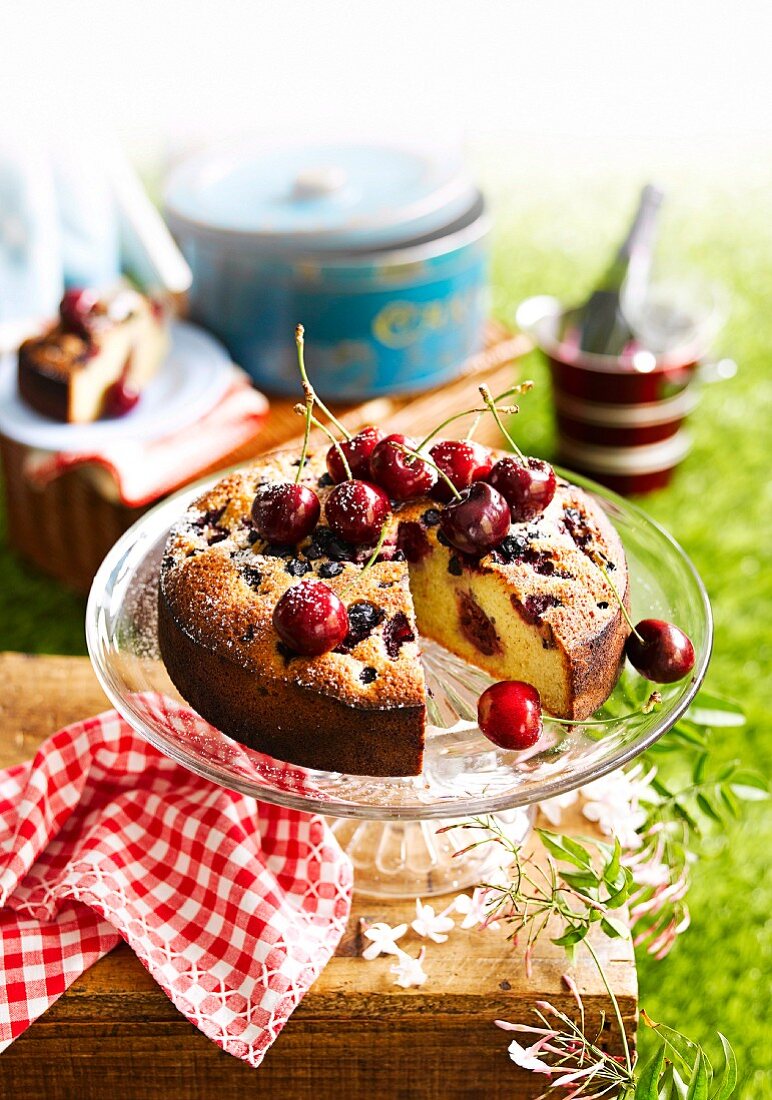 Almond cake with berries and cherries, for a picnic