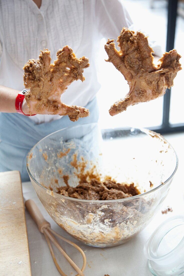 Hands sticky with dough