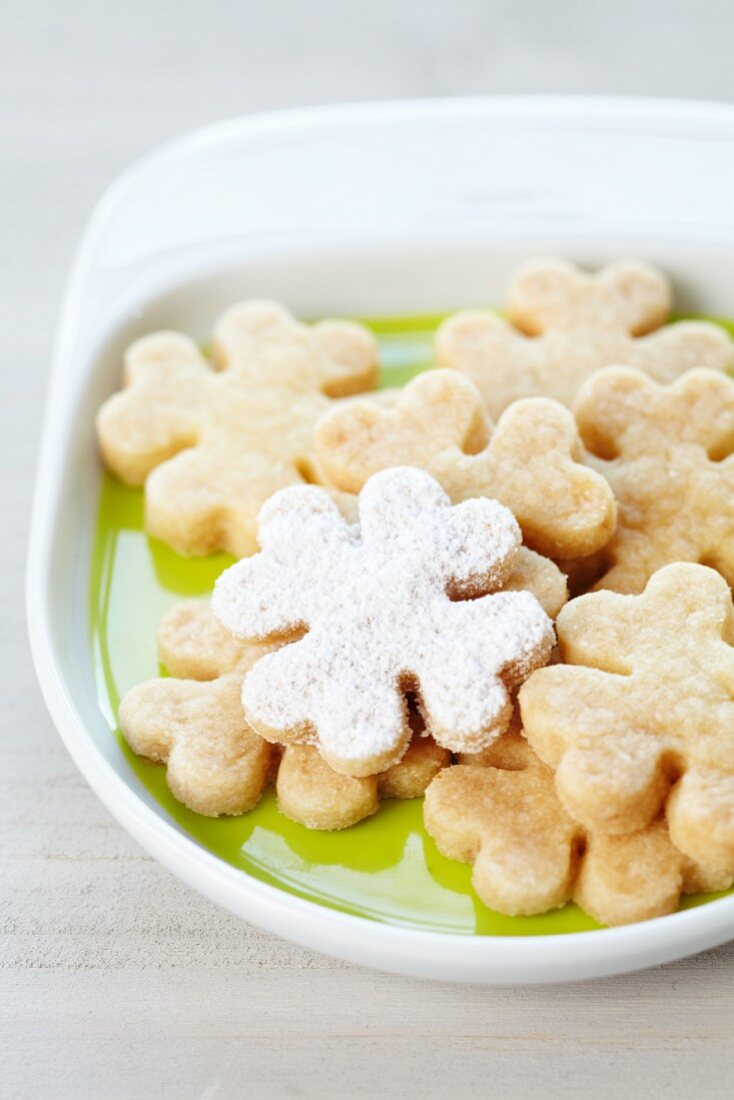 Shamrock-shaped biscuits, dusted with icing sugar
