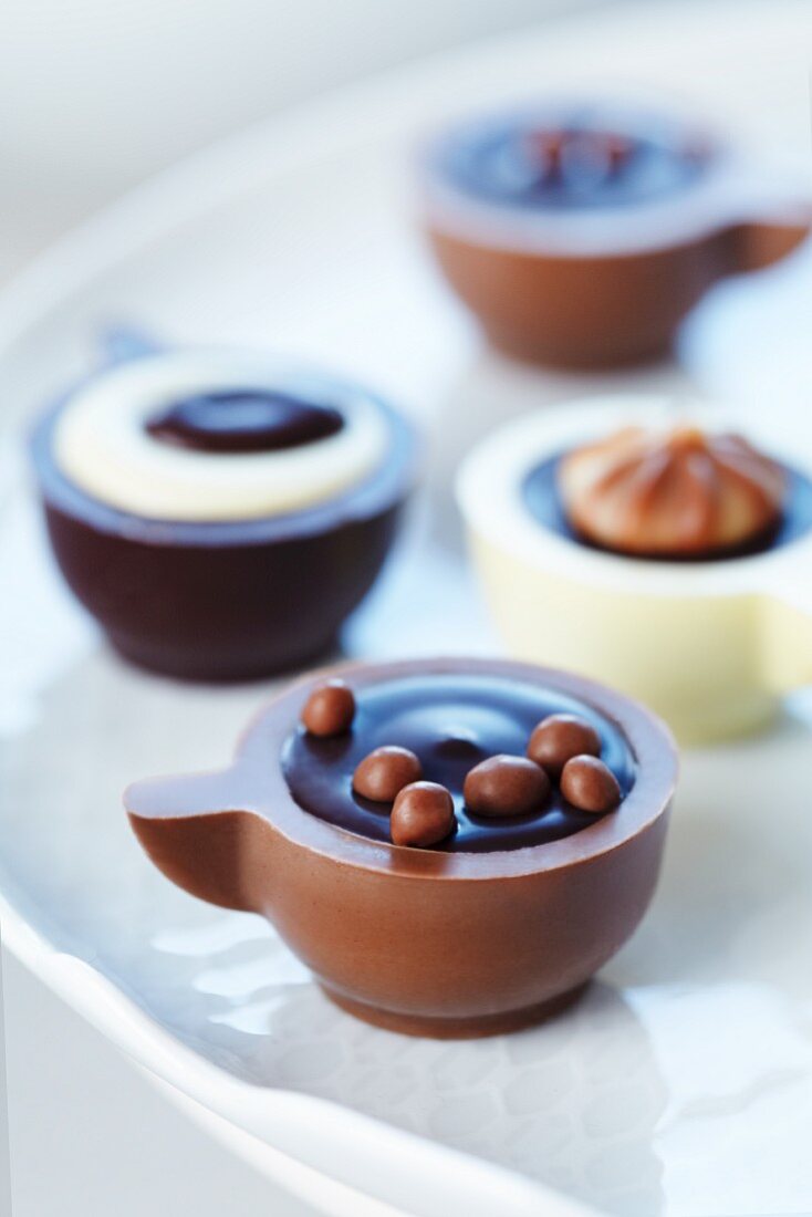 Filled chocolates in the shape of coffee cups