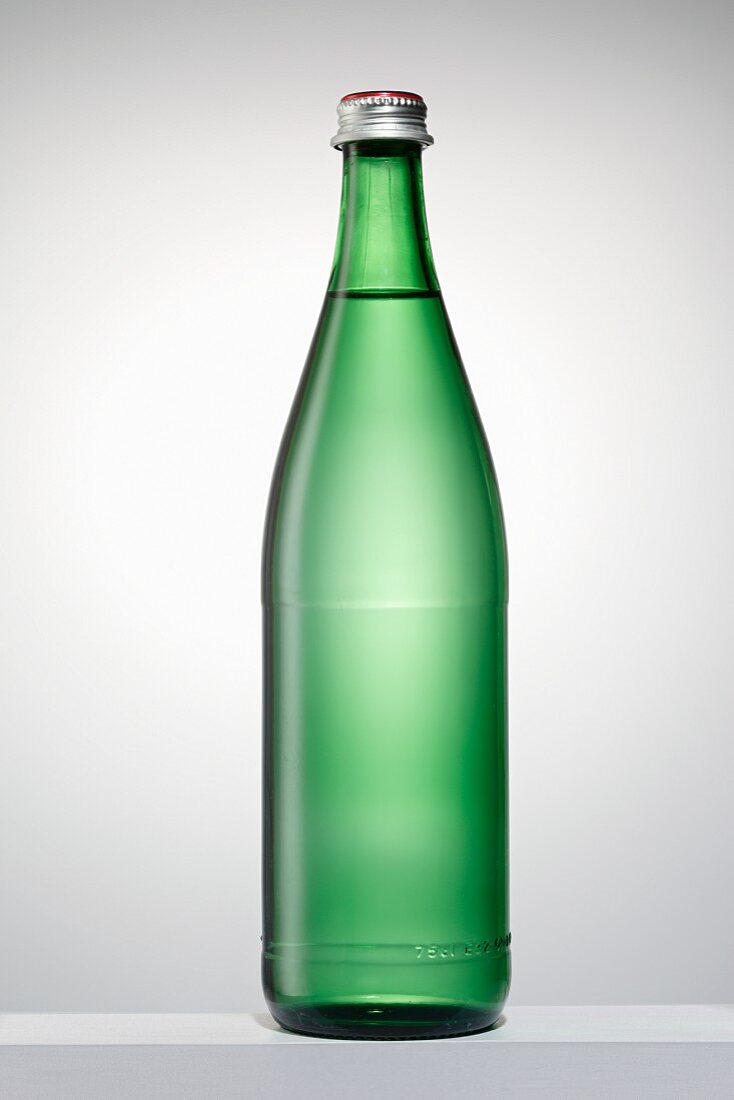 A green bottle filled with water
