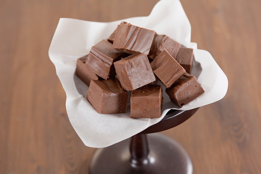 Pieces of chocolate fudge displayed on a stand