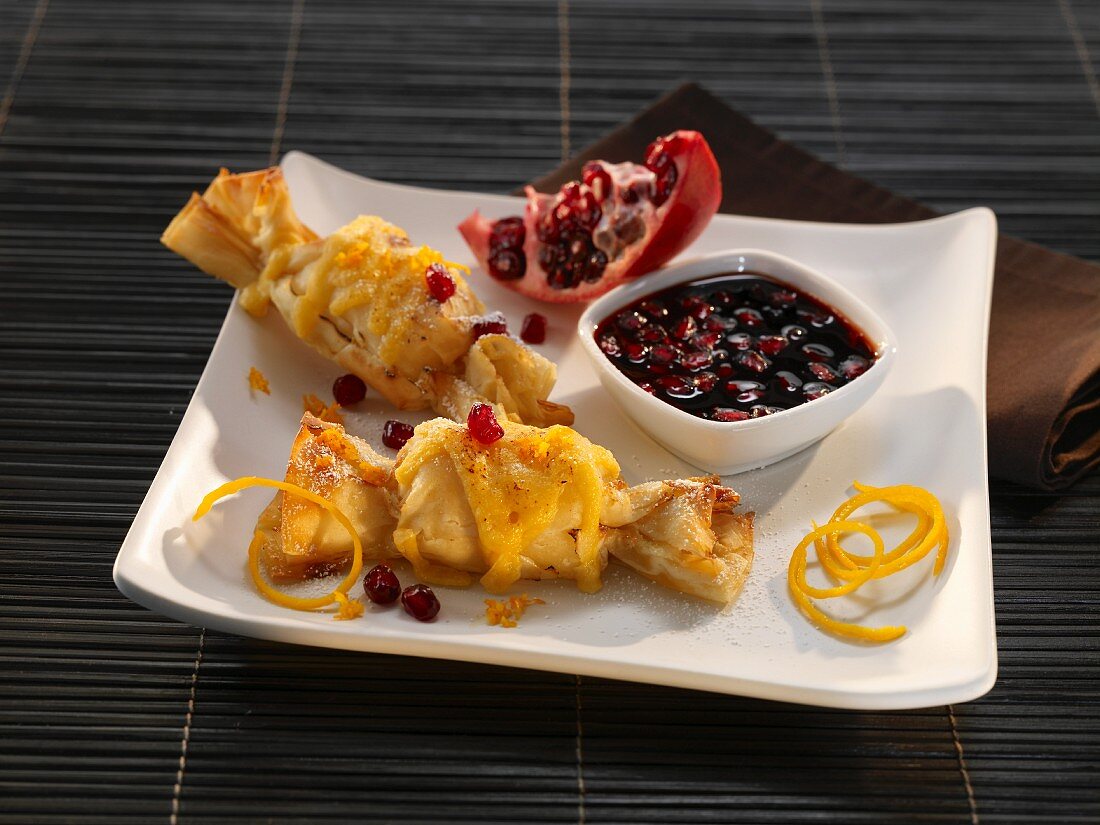 Pastry parcels with pomegranate and orange zest