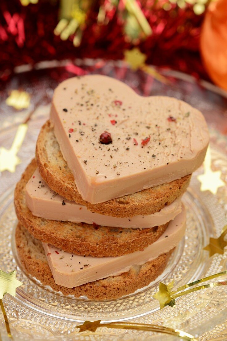 A stack of foie gras and toasted slices of bread