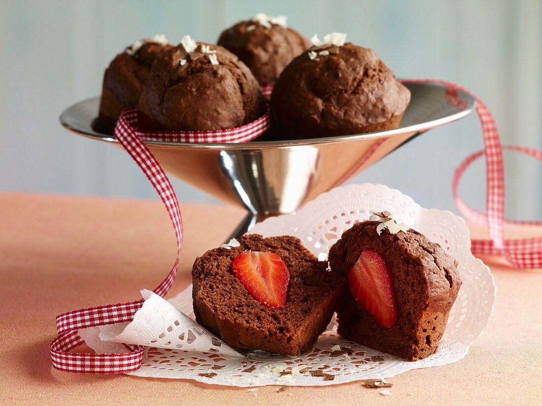 A chocolate muffin filled with strawberries