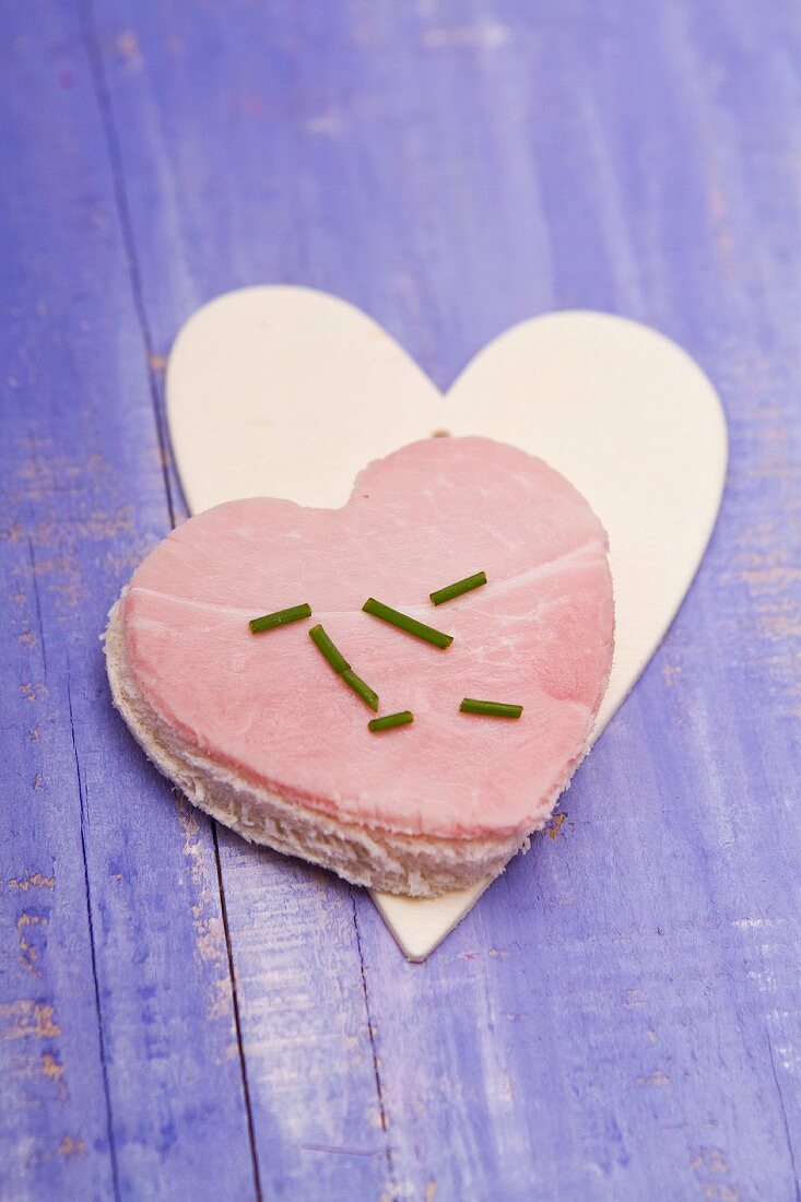 A heart cut out of bread, with ham, for Valentine's Day