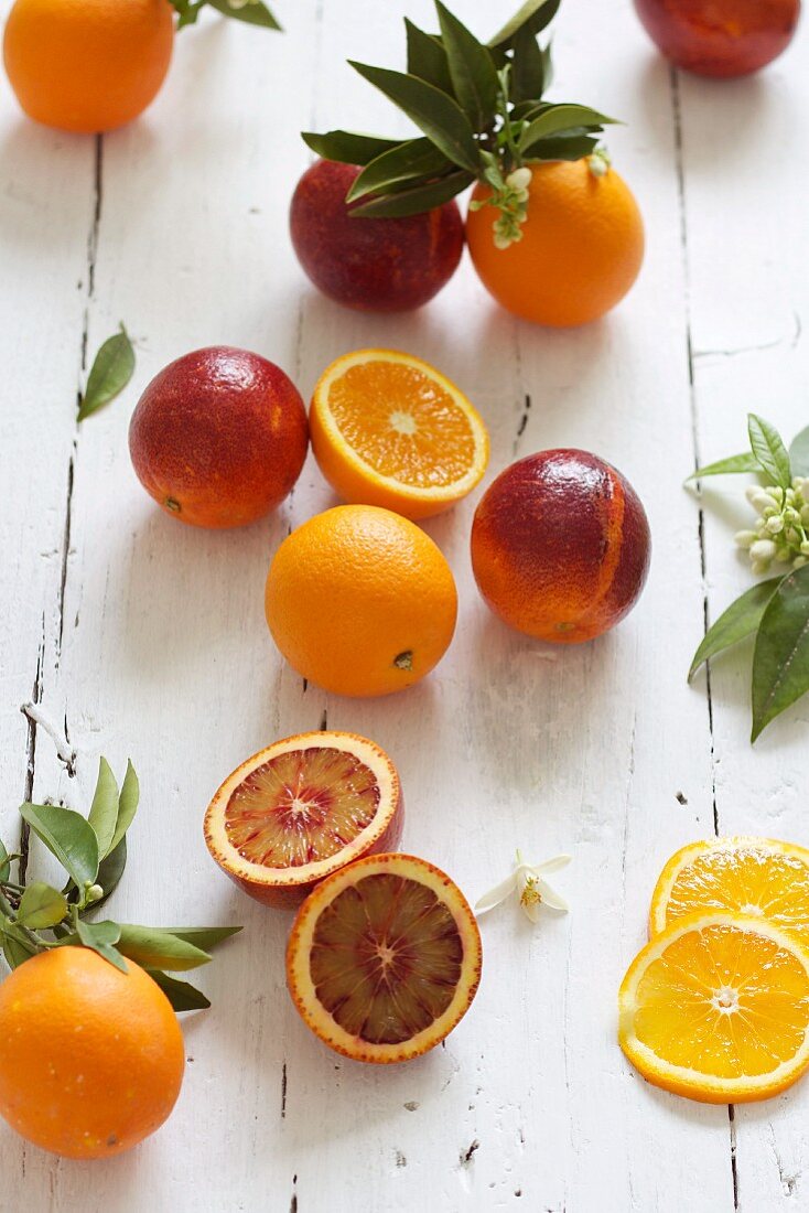 Oranges and blood oranges with leaves