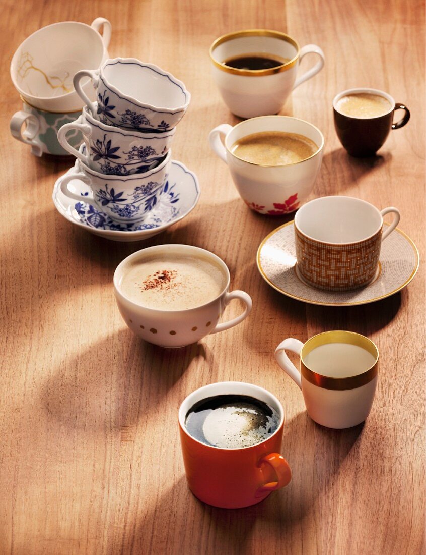 An assortment of coffee cups and varieties of coffee